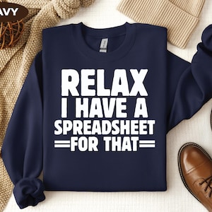 May include: Navy blue sweatshirt with white text that reads "Relax I have a spreadsheet for that".