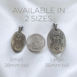 May include: Two silver oval pendants with a spider design. The pendant on the left is 28mm tall and the pendant on the right is 36mm tall.  Available in 2 sizes.