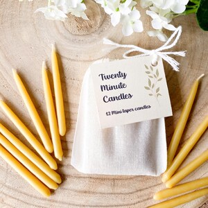 Refill set of 20 minute candles, showing the cotton bag that holds the candles with 12 pure beeswax mini candles arranged around the outside.