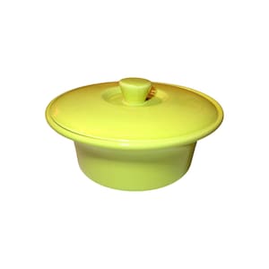 May include: A bright yellow ceramic serving dish with a lid. The dish has a rounded shape and a smooth, glossy finish.
