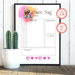 May include: A printable daily planner with a watercolor background featuring a dog. The planner has sections for agenda, shopping, to-dos, and notes. The text "Mein Tag" is at the top of the planner.