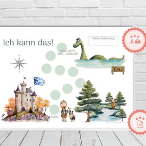 Könnte beinhalten: Ein druckbares Diagramm mit schottischem Thema für Kinder. Das Diagramm zeigt ein Schloss, ein Seeungeheuer, einen Dudelsackspieler und einen Kompass. Der Text auf dem Diagramm lautet "Ich kann das!" und "GESCHAFFT! TOLL GEMACHT!"