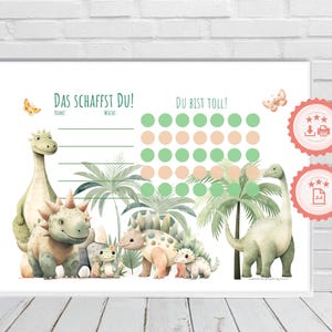 May include: A green and white dinosaur themed reward chart with the text "Das Schaffst Du!" and "Du Bist Toll!"  The chart has a section for a name and week number. There are 35 circles to color in, and a section for stickers.  The chart features a green dinosaur, a brown dinosaur, and a small green dinosaur.