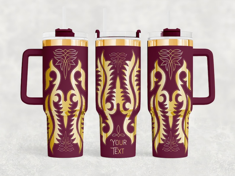 May include: A set of three maroon insulated tumblers with gold filigree designs. Each tumbler has a handle, a clear lid, and a straw. The text "YOUR TEXT" is visible on one of the tumblers. These tumblers are suitable for hot or cold beverages.