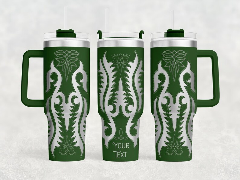May include: Green travel mug with a silver, stylized floral design. The mug has a handle, a clear lid, and a straw. The text "YOUR TEXT" is printed on the mug. The mug is designed to hold approximately 30 ounces.