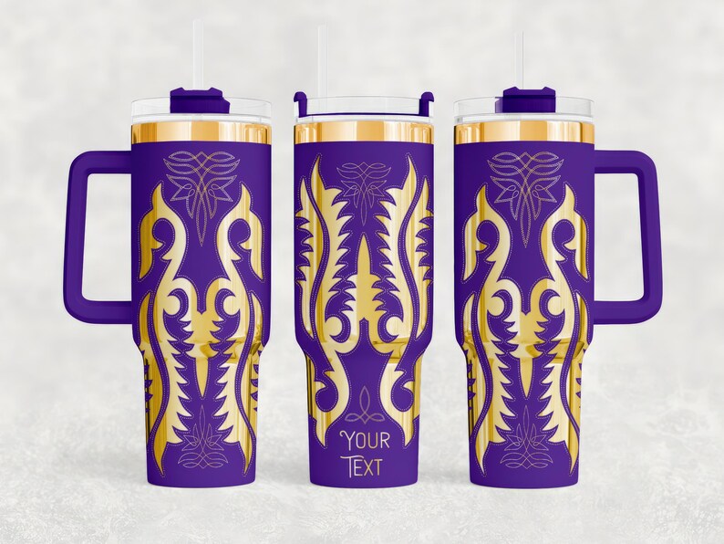 May include: Purple travel tumbler with a gold ornate design and a handle. The tumbler has a gold rim and a clear lid with a straw. The text "YOUR TEXT" is printed on the tumbler.