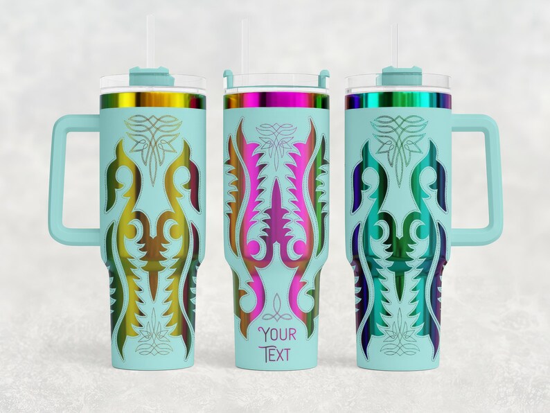 May include: Three light blue insulated tumblers with handles, lids, and straws. Each tumbler features a colorful, ornate design in shades of gold, pink, purple, and green. The middle tumbler has the text "YOUR TEXT" on it.