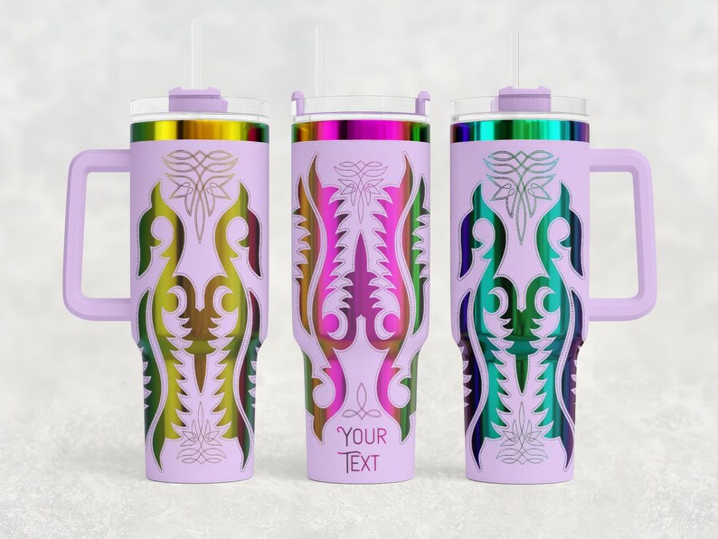 May include: Three lavender insulated tumblers with handles, each featuring a different colorful, symmetrical design. The designs include gold, green, pink, and blue accents. Each tumbler has a lid and a straw. One tumbler has the text "YOUR TEXT".
