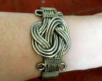 vintage Celtic infinity knot silver tone metal ropy woven braided wire ornate woven wide cuff bracelet unisex womens mens 1.25 inch wide