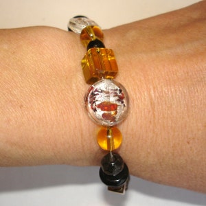 May include: A set of three ceramic nesting bowls in shades of blue, green, and white. The bowls feature a speckled glaze and a simple, modern design. The largest bowl is approximately 6 inches in diameter.