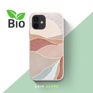 Könnte beinhalten: Handyhülle mit Landschaftsdesign in Braun-, Beige- und Blautönen. Die Hülle zeigt eine Berg- und Sonnenillustration. Das Wort "Bio" ist in Schwarz mit einem grünen Blattlogo aufgedruckt. Der Text "GAIA GUARD" ist unten aufgedruckt.