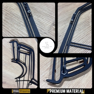 May include: Black metal wall art sculpture of a car with a unique design. The sculpture is made of metal and has a black finish. The sculpture is mounted on a wooden wall. The sculpture is made by Unique Metal Art Design.