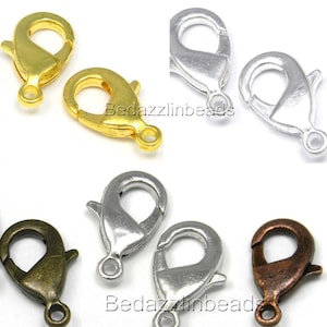 May include: Set of six lobster claw clasps in four different finishes: gold, silver, antique brass, and copper. The clasps are a popular choice for jewellery making and are durable and easy to use.