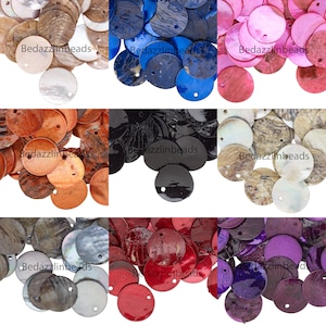 May include: Assortment of round, iridescent, shell-like, decorative, flat,  circular,  beads with a hole in the center. The beads are in various colors, including blue, pink, brown, black, red, and purple. The beads are arranged in a grid pattern.  The text "Bedazzlinbeads" appears in the image.