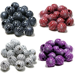 May include: A collection of spherical beads arranged in four distinct color groups. Each bead features a printed white spiderweb pattern. The sets include black, red, white, and purple beads, all with a central hole for threading purposes.