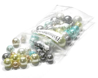 May include: A bag of assorted pearl beads in white, cream, light blue, and gray colors. The bag is labeled "Beadzillions" and says "Beads & Jewelry Made with Love".