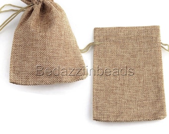 May include: Two small brown burlap drawstring bags. The bags are made of a natural woven fabric and have a rustic look.