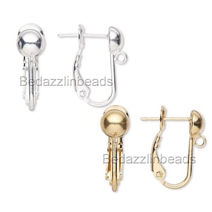 May include: Two pairs of earring findings, one pair in silver and one pair in gold. Each finding has a round ball at the top and a clip-on back.