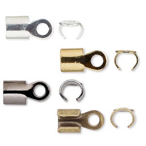 May include: A selection of metal jewellery findings, including crimp ends and clasp components. The findings are in silver, gold, and gunmetal finishes. The image shows the components from multiple angles, highlighting their design and construction.
