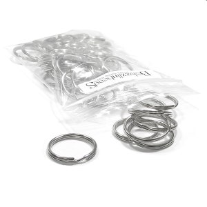 May include: A bag of silver key rings. The bag is labeled "Speedizzler" and has the text "adding brilliance to your life".