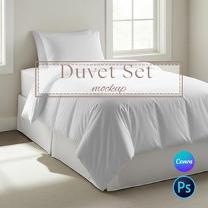 May include: A white duvet set on a bed, including a duvet cover, pillow, and bed skirt. The words "Duvet Set mockup" are displayed on the duvet cover. The bed is near a window, and the room has a neutral color scheme.