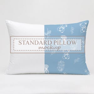 May include: Rectangular pillow with a two-tone design. One half is white, the other is light blue with a pattern of teddy bears and floral elements. The text "STANDARD PILLOW mockup" is printed on the pillow.