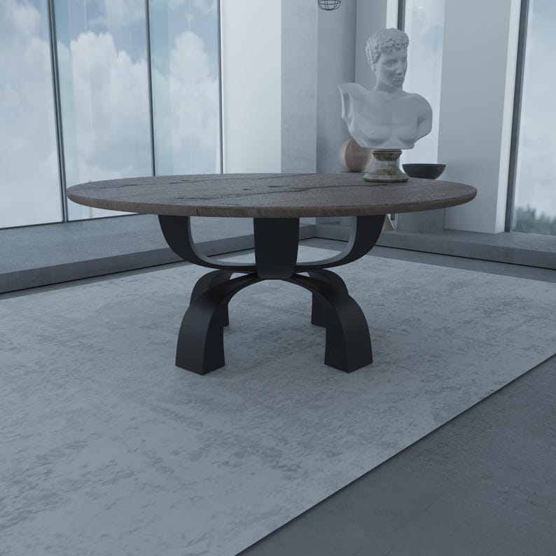 May include: A round wooden table with a black metal base. The table has a rustic, reclaimed wood top and a simple, modern design.