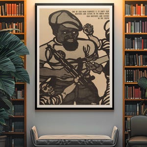 May include: Black and white illustration of a man holding a rifle with the text "ONE OF OUR MAIN PURPOSES IS TO UNIFY OUR BROTHERS AND SISTERS IN THE NORTH WITH OUR BROTHERS AND SISTERS IN THE SOUTH".