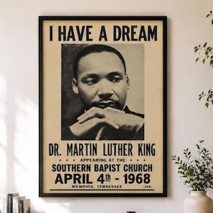 May include: A framed poster featuring a black and white portrait of Dr. Martin Luther King with his hands clasped. The text reads I HAVE A DREAM, DR. MARTIN LUTHER KING, APPEARING AT THE SOUTHERN BAPTIST CHURCH, APRIL 4TH - 1968, MEMPHIS, TENNESSEE.