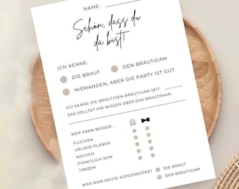 May include: A printable wedding game with the text "Schön, dass du da bist!" (German for "It's great you're here!") and questions about the bride and groom.