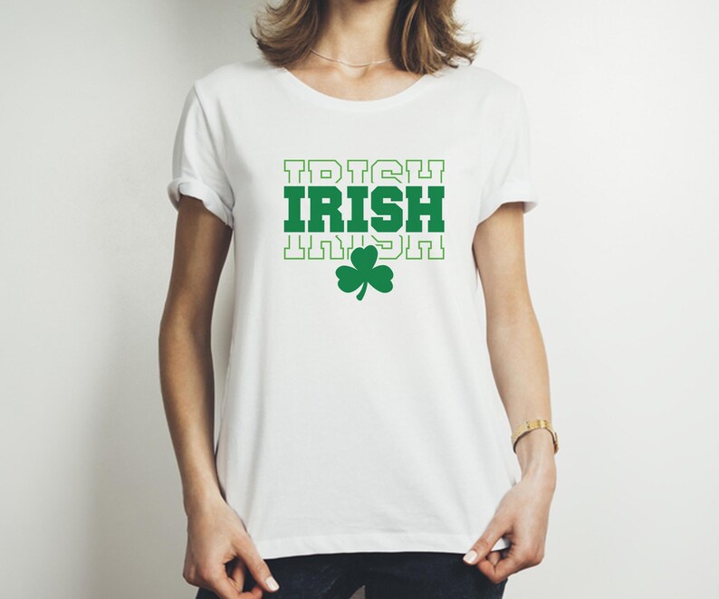 May include: White t-shirt with a green shamrock and the text "IRISH" repeated three times.