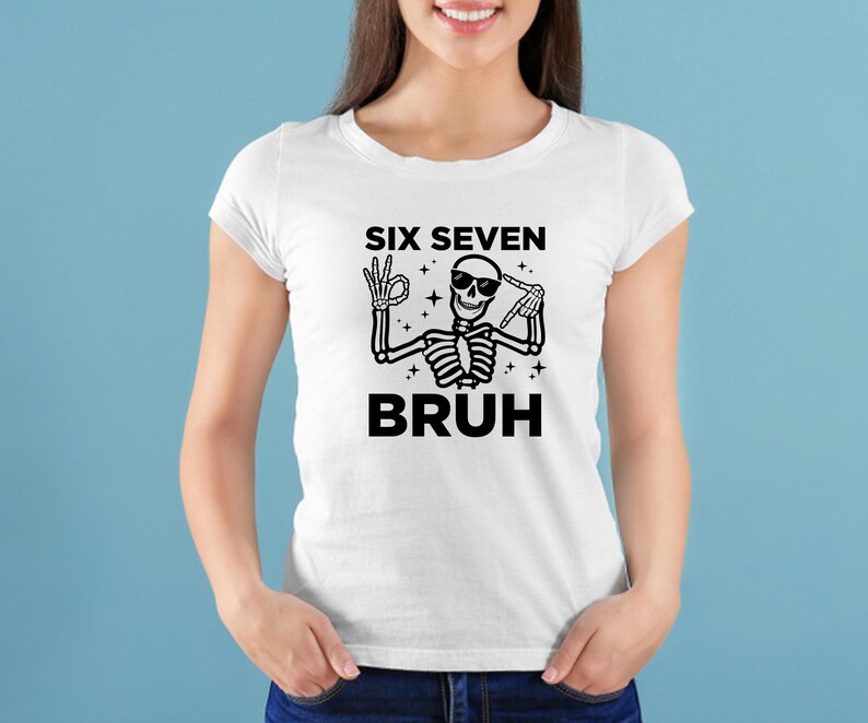 May include: White t-shirt with a black skeleton graphic. The skeleton is wearing sunglasses and making hand gestures. The text on the shirt reads "SIX SEVEN BRUH".