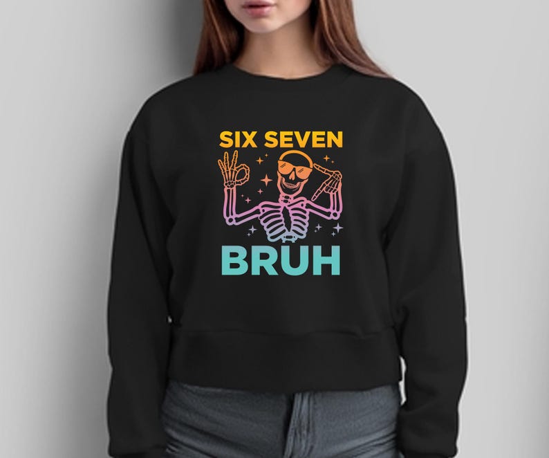 May include: Black sweatshirt with a skeleton graphic wearing sunglasses and making hand gestures. The text "SIX SEVEN BRUH" is in a gradient of yellow, pink, and blue.
