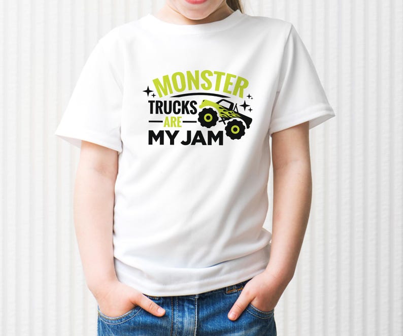 May include: White t-shirt with a green and black graphic that says "Monster Trucks Are My Jam".