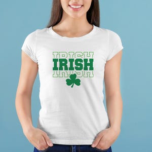 May include: White t-shirt with a green shamrock and the word "IRISH" repeated three times in a stacked design.