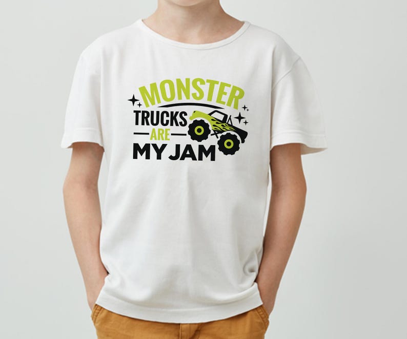 May include: White t-shirt with a green and black graphic that says "Monster Trucks Are My Jam". The graphic includes a cartoon monster truck.