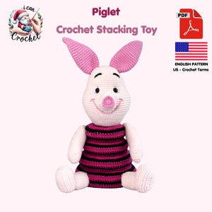 May include: A handmade crochet Piglet stacking toy. The toy is white with pink ears, a pink nose, and a black and pink striped dress. The text "Piglet Crochet Stacking Toy" is displayed above the toy.