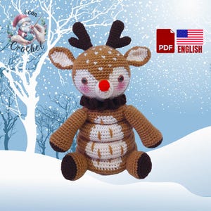 May include: Crocheted reindeer toy with brown and white fur, a red nose, and brown antlers. The reindeer is sitting on a snowy background.