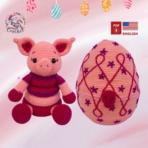 May include: A pink crocheted pig wearing a pink and purple striped shirt sits next to a pink crocheted egg with a pink rose and purple flower accents. The egg has a pink and purple swirl design. The image includes the text "PDF" and "ENGLISH".