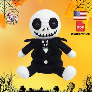 May include: A handmade crochet doll of Jack Skellington from The Nightmare Before Christmas. The doll has a white head with black eyes and a stitched smile. It wears a black suit with white accents. The image includes the text "English Pattern".