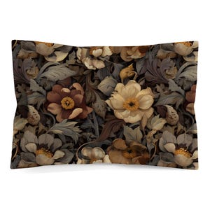 May include: A rectangular pillow sham featuring a dense, repeating pattern of large, layered flowers in shades of cream, beige, and deep brown. The floral design is interspersed with intricate, dark grey-brown acanthus-style foliage.