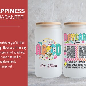 May include: Two white tumblers with a wood lid and a straw. The tumbler on the left has a colorful ABC design with the text "The Daycare Tour" and "Mrs. Wilson". The tumbler on the right has the text "Daycare Tour" and a list of daycare provider duties. The text "Some days I rock it. Some days it rocks me. Either way we're rockin'" is at the bottom.