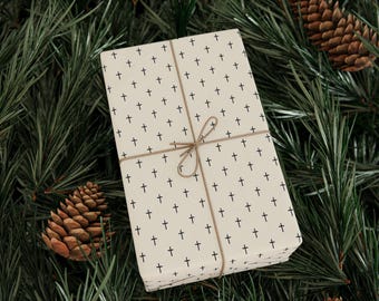 Papel de regalo minimalista con cruces, papel de regalo cristiano, papel navideño negro sobre crema, decoración festiva moderna.
