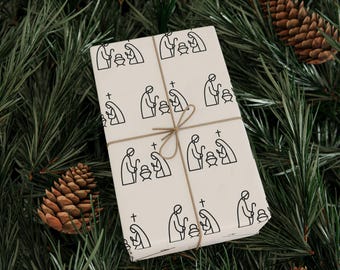 Papel de regalo para la Natividad, papel de regalo cristiano minimalista, papel navideño negro sobre crema, decoración festiva moderna.
