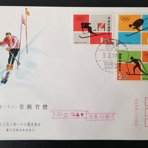 May include: An envelope featuring a skier illustration and stamps with Olympic rings and skier silhouettes. The stamps are in red, orange, green, and blue. The envelope has Chinese text and a postmark dated March 2, 1972.