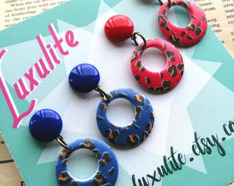 Two pair pack! Mini leopard print drop hoop earrings in vibrant blue and pinky-red by Luxulite