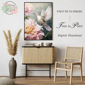 May include: A digital download paint by numbers image featuring a hummingbird in flight over a pink flower. The text "Paint by Numbers | Time to Paint | Digital Download" is displayed on a white background.