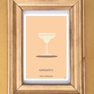Può includere: Una stampa incorniciata con un'illustrazione minimalista di un bicchiere da cocktail margarita. Il testo "MARGARITA" e "JACK KEROUAC" sono stampati sotto l'immagine.