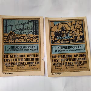 May include: Two vintage German paper ephemera cards. Each card features a colorful illustration with text in German. The top section of each card has a different illustration. The bottom section of each card has the same text. The cards are on a beige background.