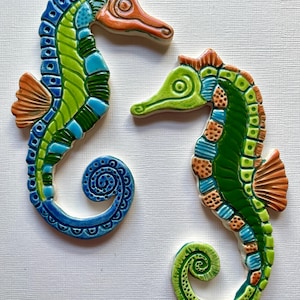 Handmade ceramic colourful Seahorse mosaic tile shapes. Incised and hand painted to add a unique addition to your mosaic or craft project.